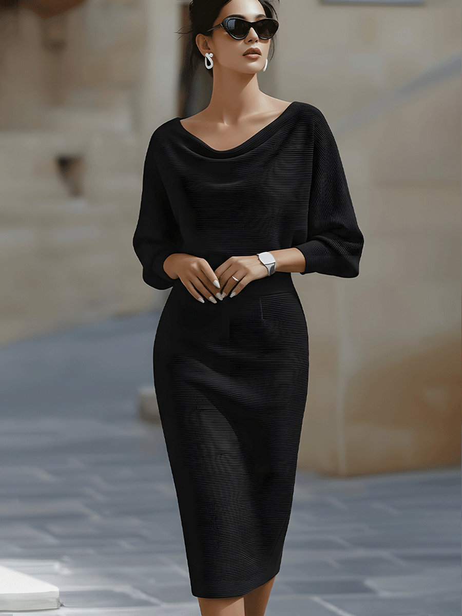 Robe midi à manches chauve-souris Lydia de Danoir Paris, élégante avec tissu drapé, portée longue et fluide.