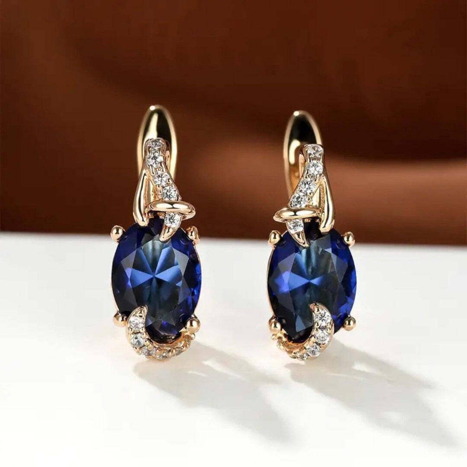 Boucles d'oreilles Regal Midnight Danoir Paris avec pendentifs suspendus en métal argenté et détails élégants.