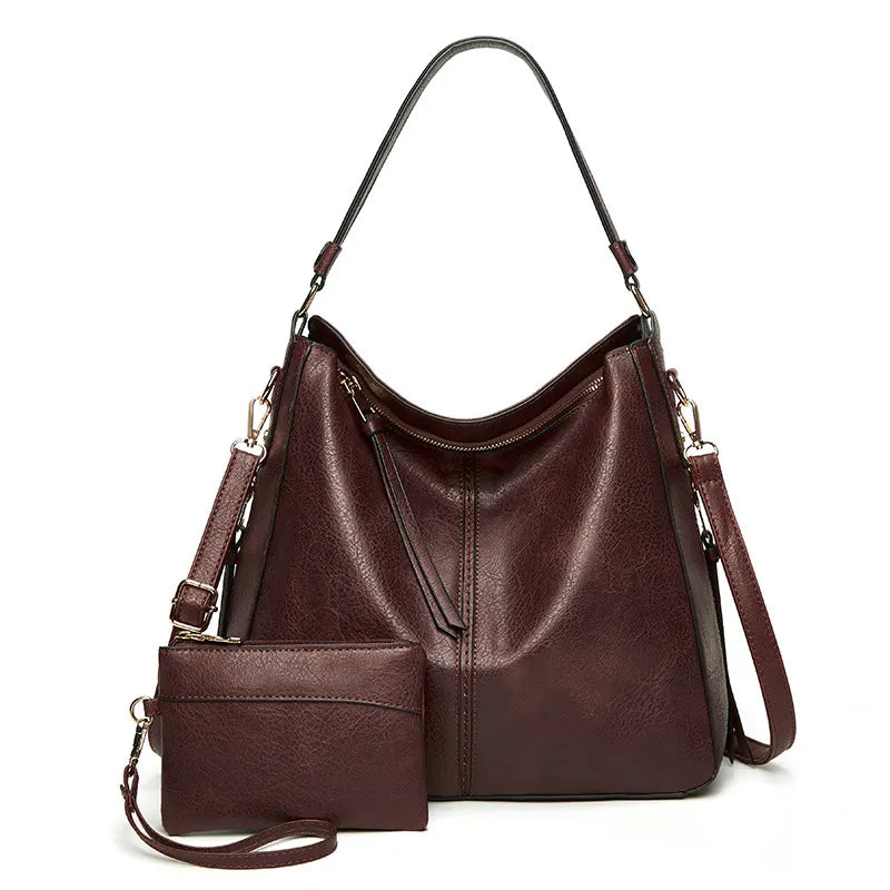 Sac à main en cuir vintage Étoile de Ville de Danoir Paris, couleur classique, avec poignées et détails élégants.