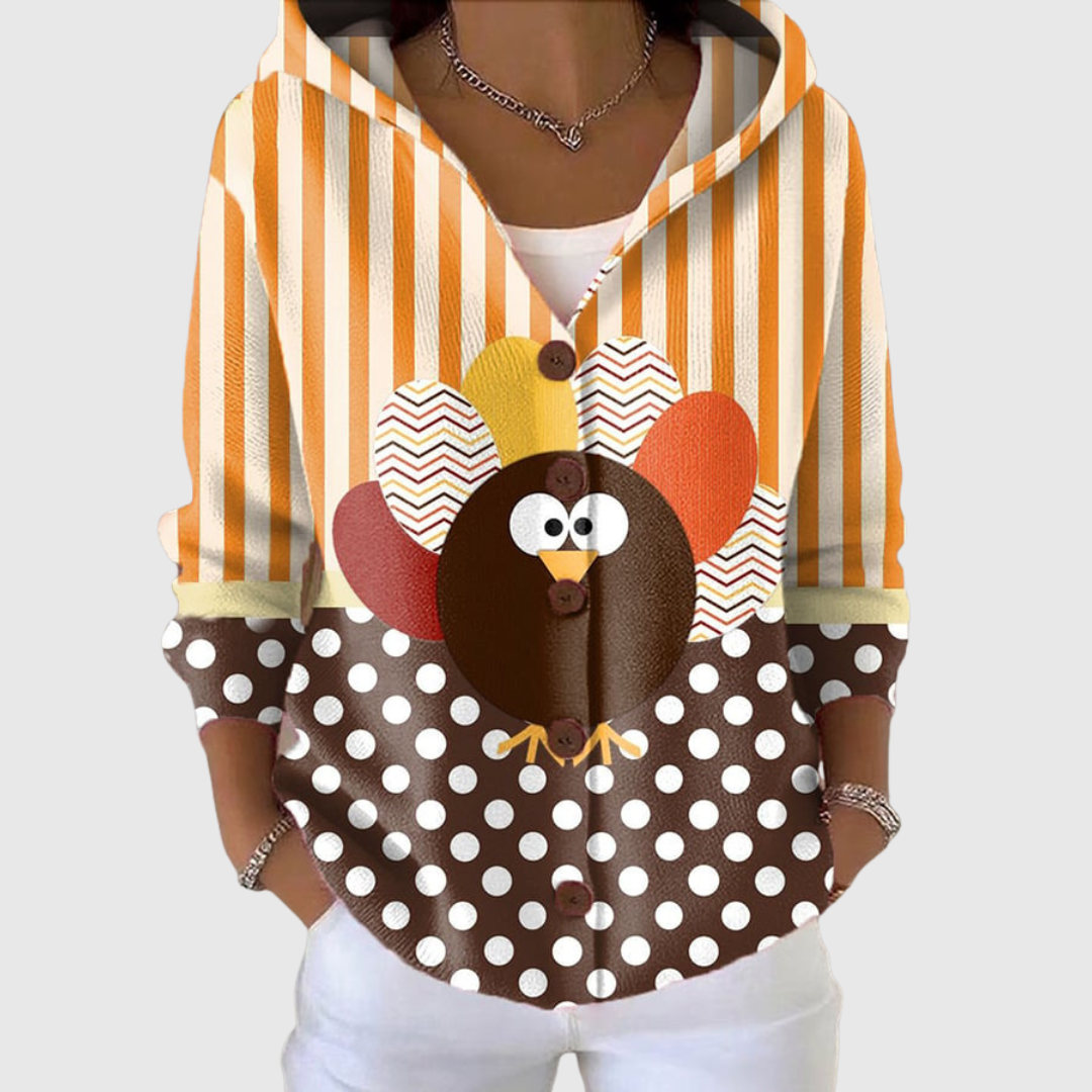 Cardigan confort à capuche en maille Danoir Paris, doux et chaud, porté par-dessus un t-shirt, couleur gris clair.