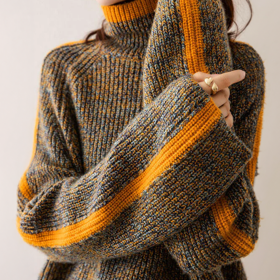 Pull Emily Danoir Paris en maille élégante et confortable, porté par un mannequin debout, couleur neutre.