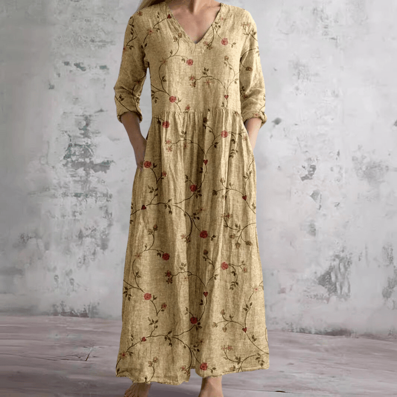 Robe d'été florale Erica™ de Danoir Paris, tissu léger, motif floral coloré, portée décontractée et élégante.