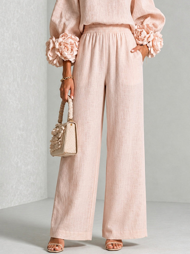Ensemble deux pièces Danoir Paris avec manches florales, vêtement rose avec motifs floraux visibles.