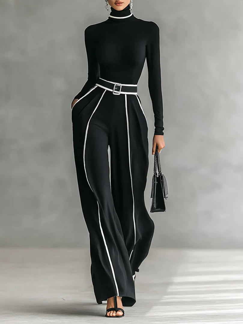 Robe élégante Danoir Paris Emma avec col montant et pantalon large, vue en gros plan sur le tissu et la coupe du costume.