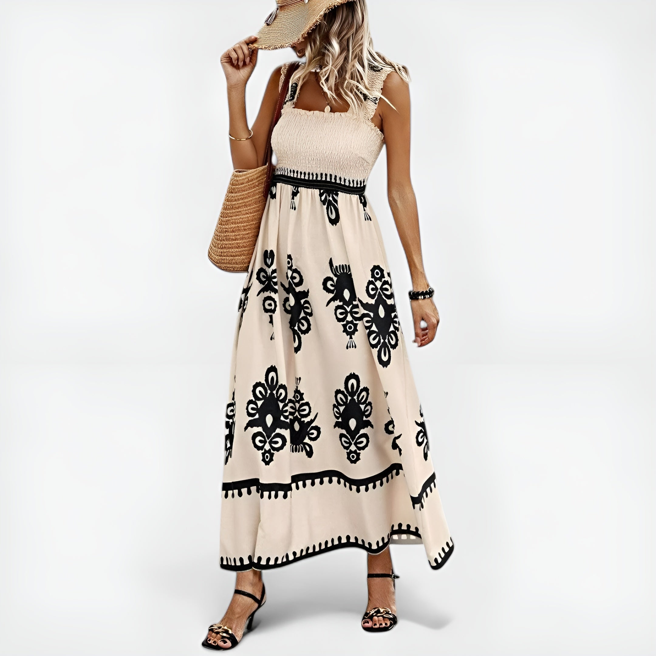 Robe d'été Magda de Danoir Paris, style unique, tissu léger et coloré, portée avec accessoires estivaux.