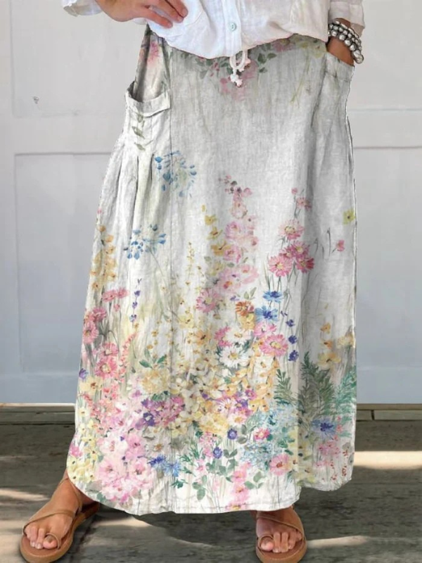Jupe beige Mella™ Danoir Paris à motifs floraux rétro, taille élastique et poches.