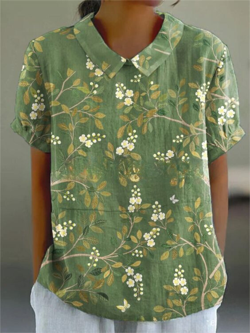 Chemise fleurie élégante Sofia de Danoir Paris, tissu fluide avec motif floral coloré et détails sophistiqués.