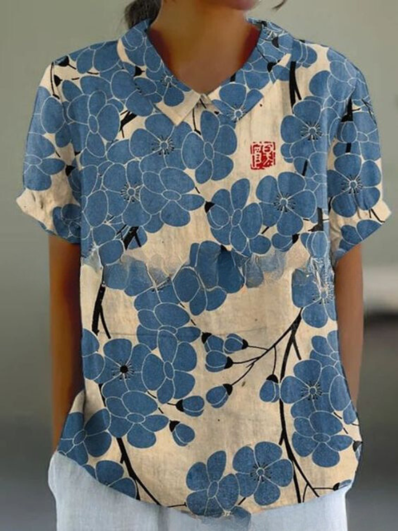 Chemise fleurie élégante Sofia de Danoir Paris, tissu léger avec motif floral coloré, portée décontractée ou chic.