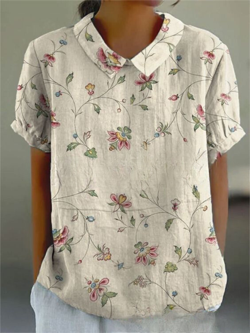 Chemise fleurie élégante Sofia de Danoir Paris avec motif floral coloré, portée sur un mannequin.