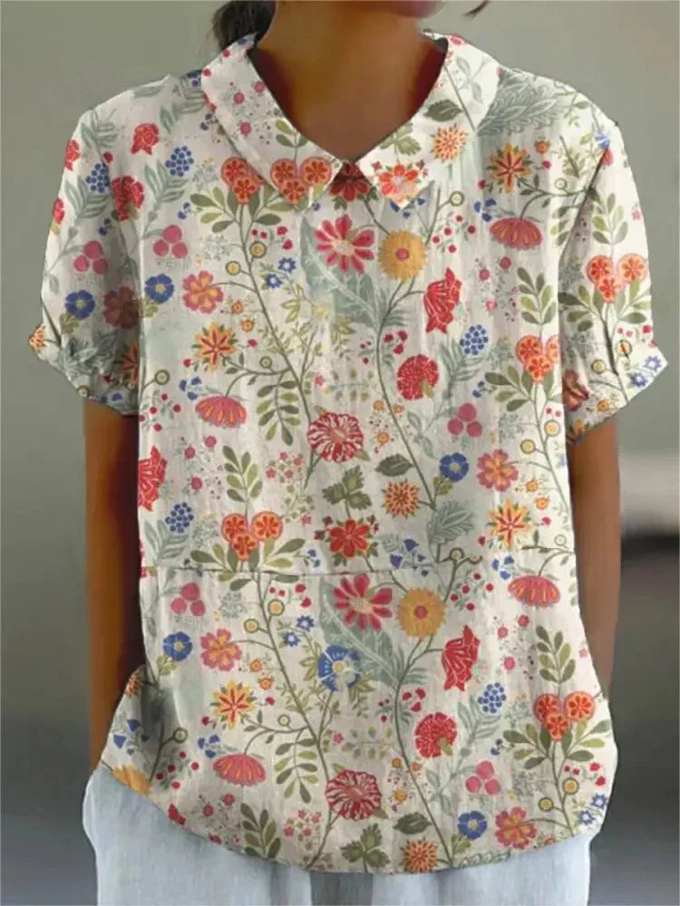 Chemise fleurie élégante Sofia de Danoir Paris, tissu léger avec motifs floraux, idéale pour un style sophistiqué.