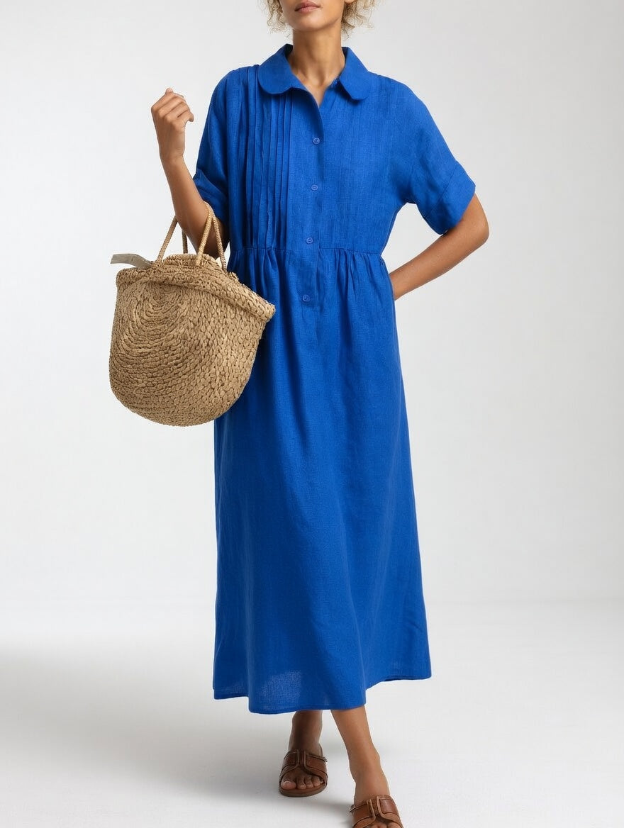 Robe chemise fluide estivale Lysandra™ blanche de Danoir Paris, légère et élégante, portée sur un fond neutre.