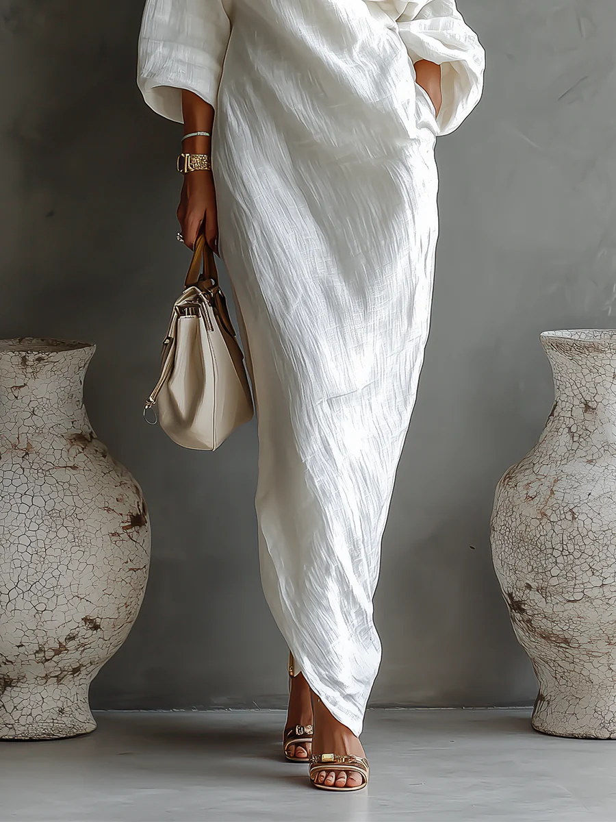 Robe maxi asymétrique élégante Elise™ de Danoir Paris, en tissu fluide, avec détails sophistiqués et coupe moderne.