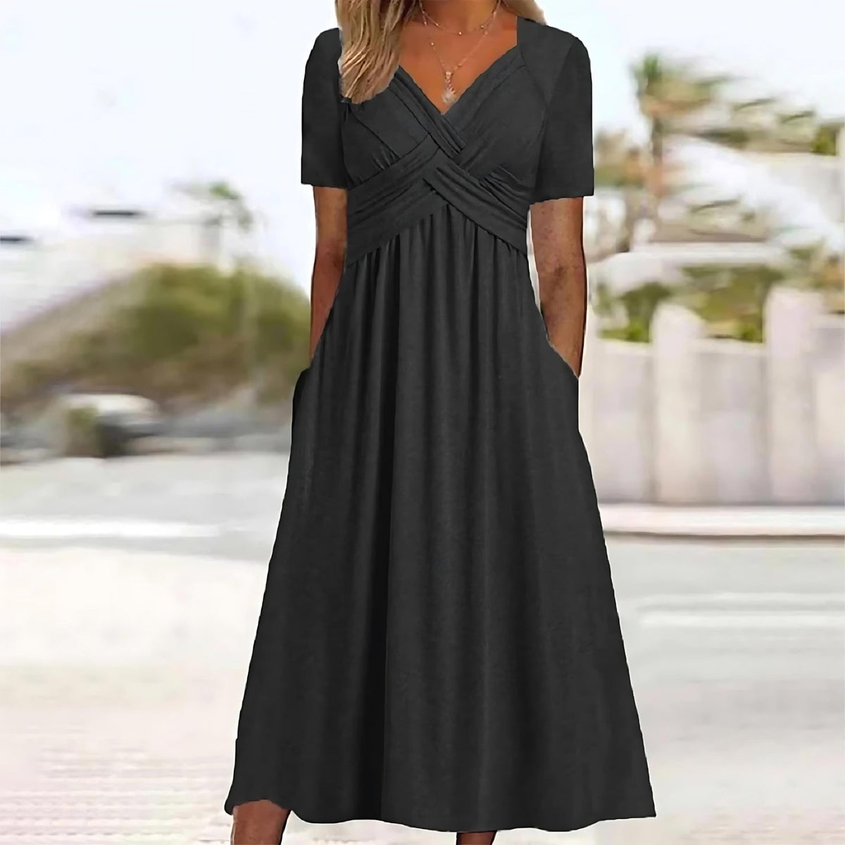 Robe longue élégante Nadine de Danoir Paris en tissu bleu, vue de face, avec détails sophistiqués et coupe fluide.