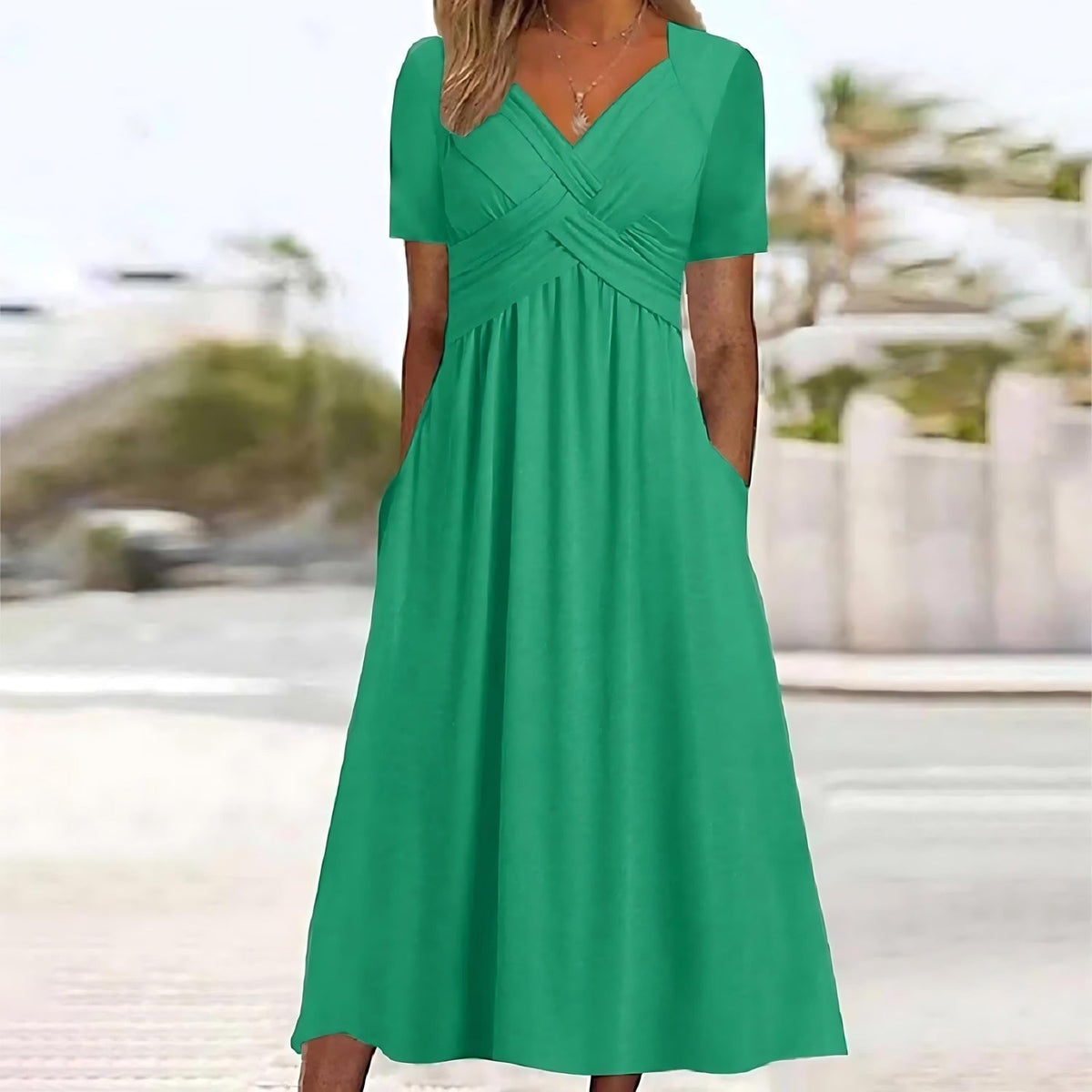 Robe longue élégante Nadine de Danoir Paris en tissu bleu, vue de face, avec détails raffinés et coupe fluide.