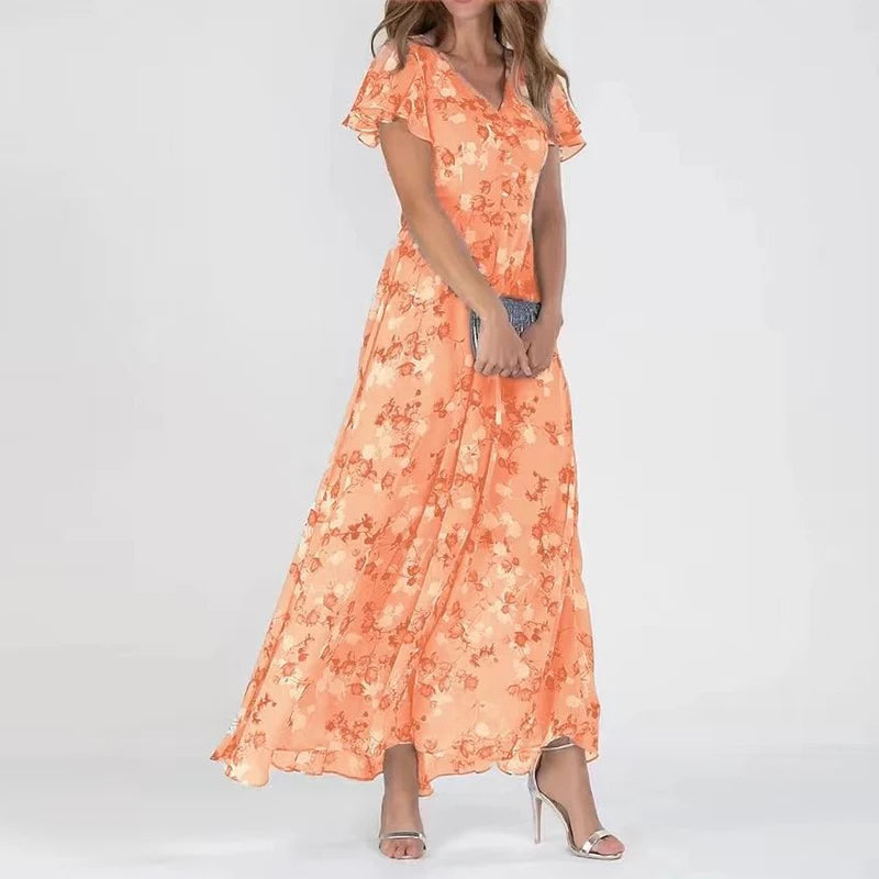 Robe maxi fleurie élégante Danoir Paris, longueur fluide, motif floral coloré, col en V, parfaite pour une occasion chic.