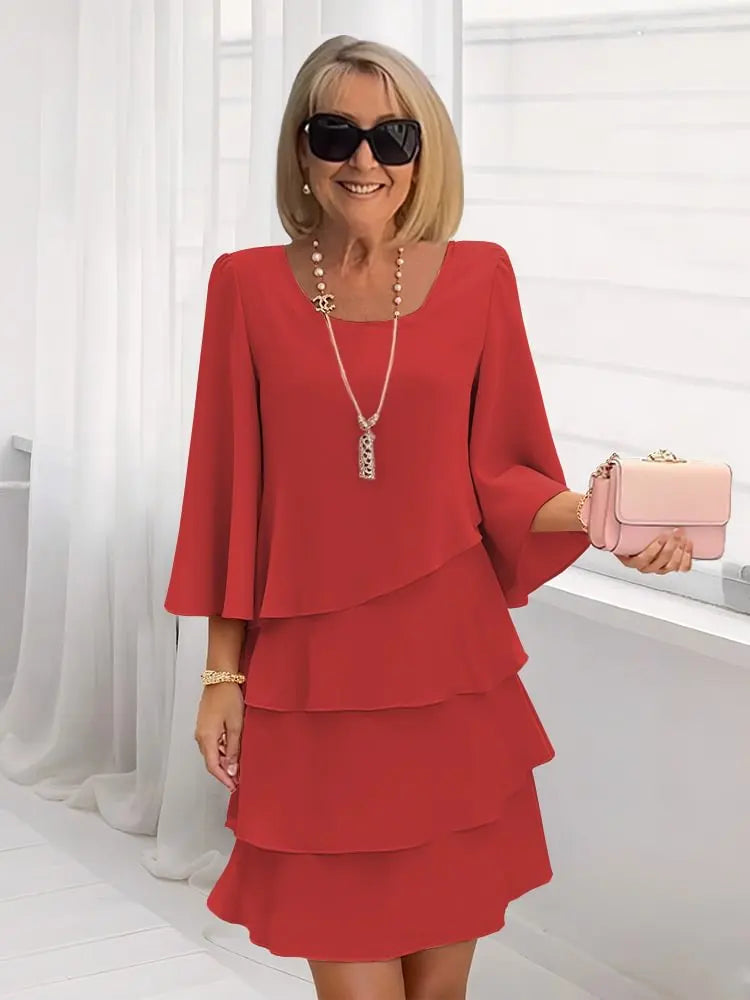 Robe élégante Catherine de Danoir Paris en tissu blush avec volants, coupe fluide et détails raffinés pour un look sophistiqué.