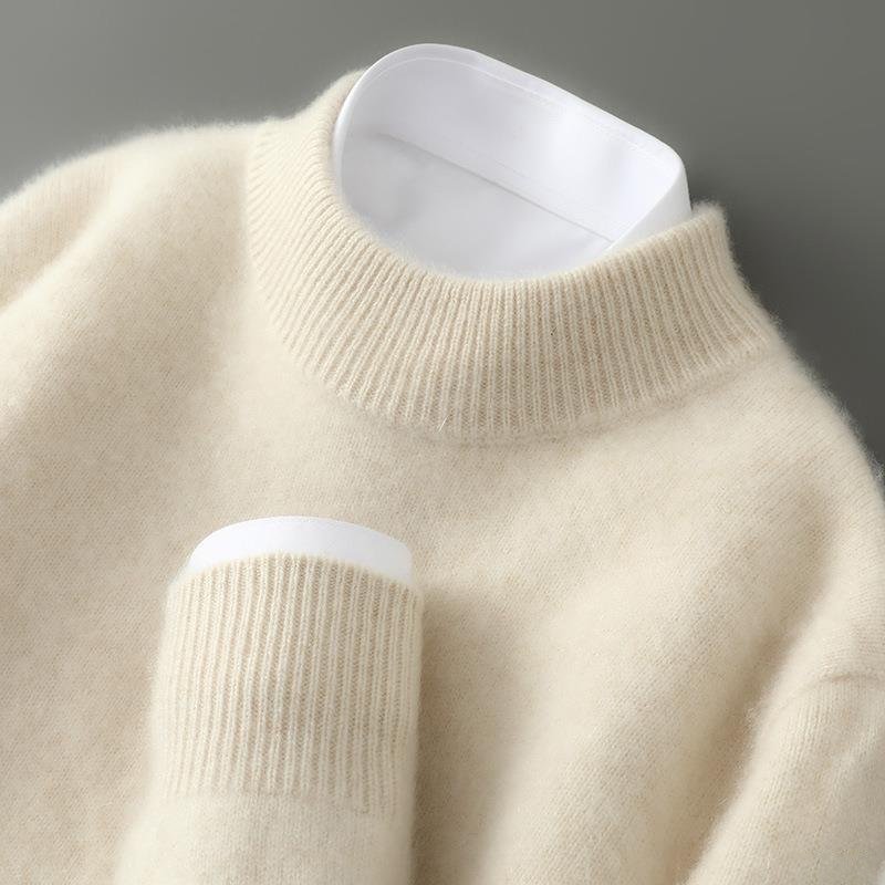 Pull en cachemire élégant Claude de Danoir Paris, couleur crème, coupe ajustée, tissu doux et raffiné, idéal pour un style sophistiqué.