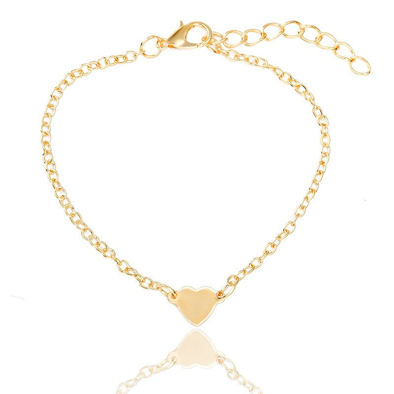 Bracelet doré Danoir Paris offert, visible sur fond neutre avec détails brillants et finition élégante.