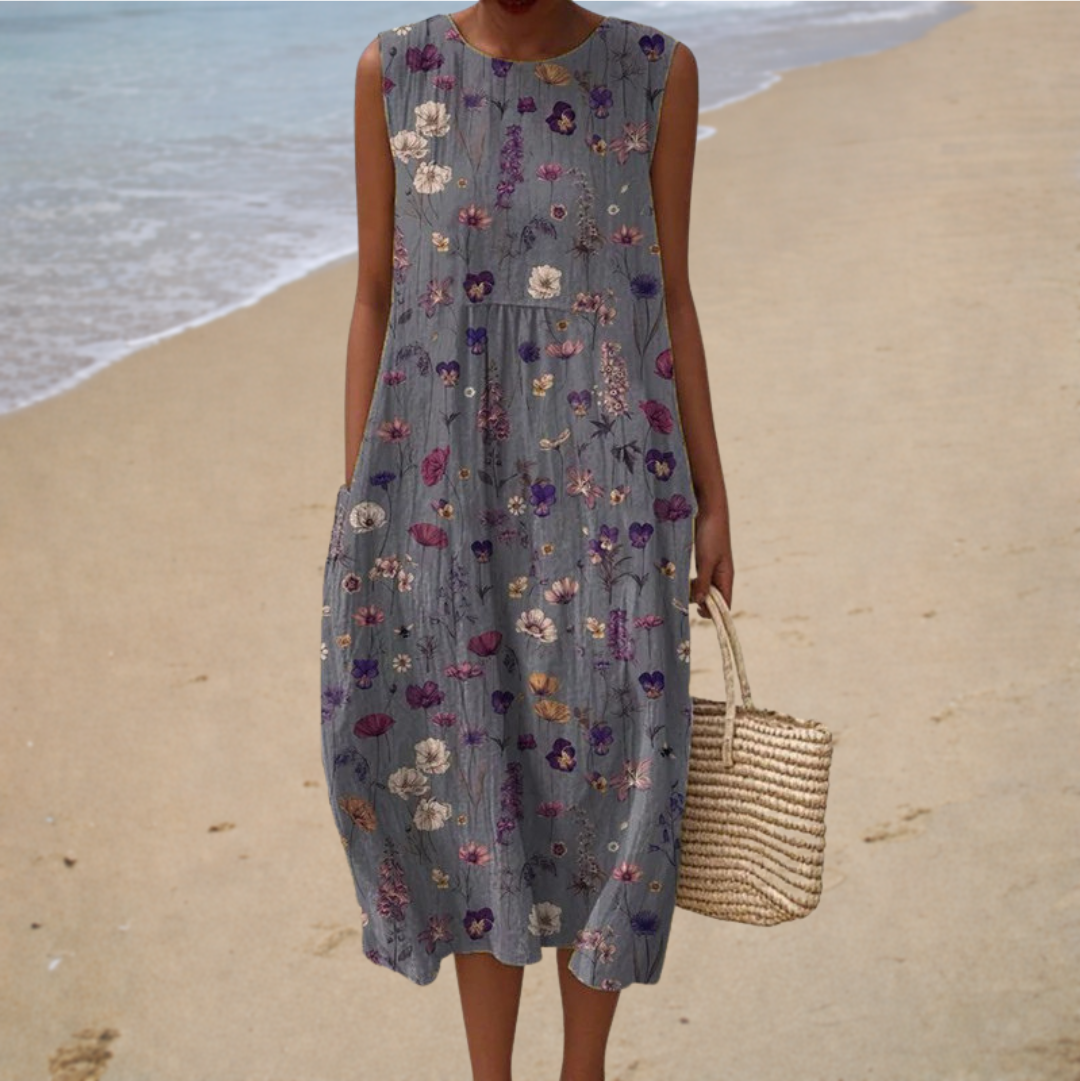 Robe midi champêtre Danoir Paris Geneviève avec imprimé floral et manches longues, portée dans un cadre printanier.