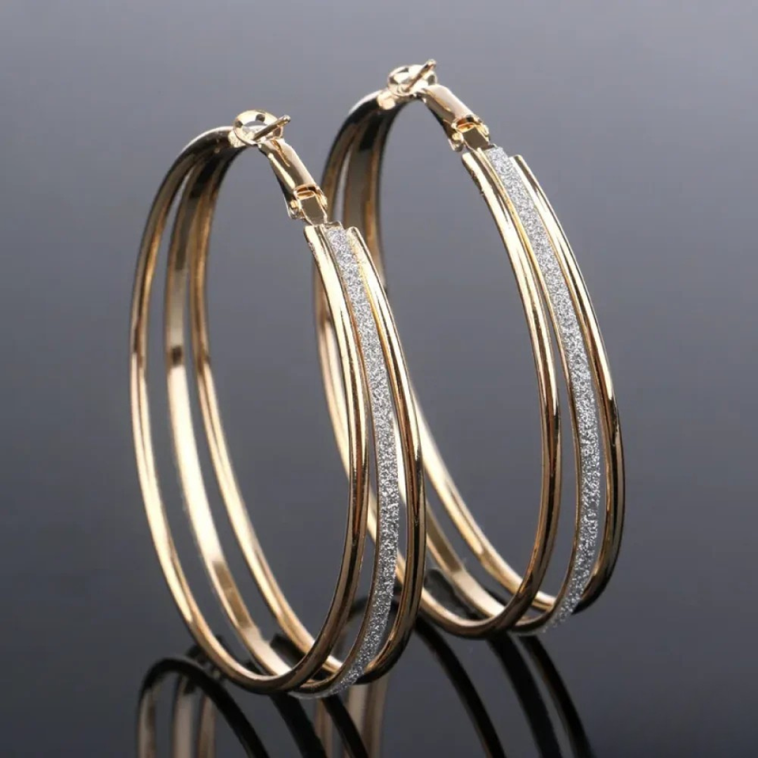Boucles d'oreilles créoles rétro en or Danoir Paris, élégantes et en finition dorée, pour un style vintage sophistiqué
