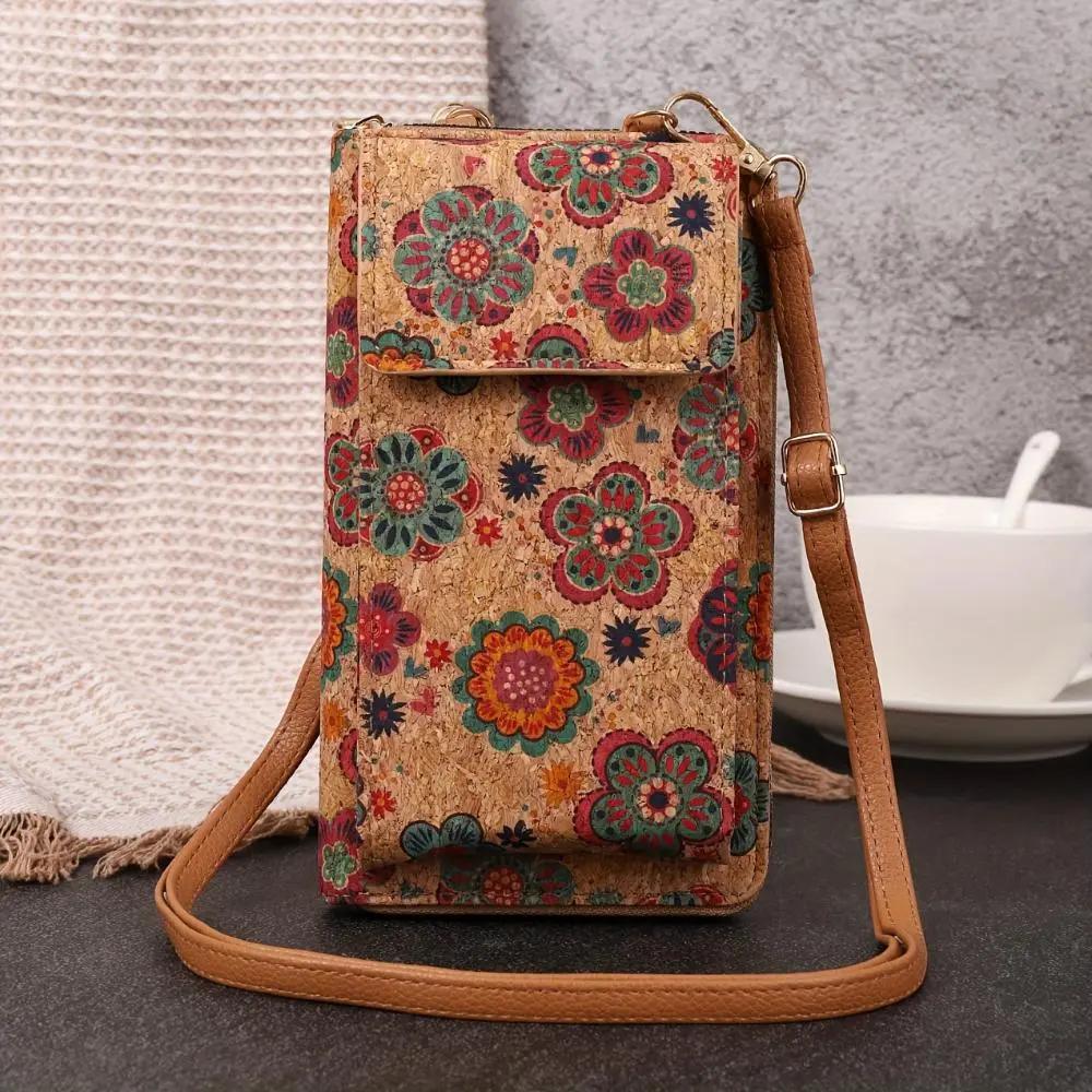 Sac bandoulière boho-fleurs Nina Danoir Paris, accessoire mode avec motifs floraux colorés et détails en cuir.