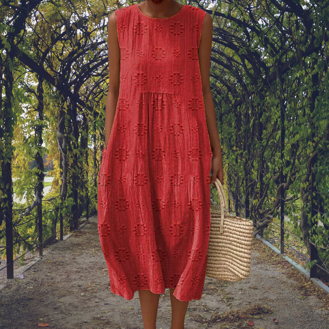 Robe sans manches Linda élégante de Danoir Paris, style sophistiqué, en tissu fluide, portée féminine et moderne.