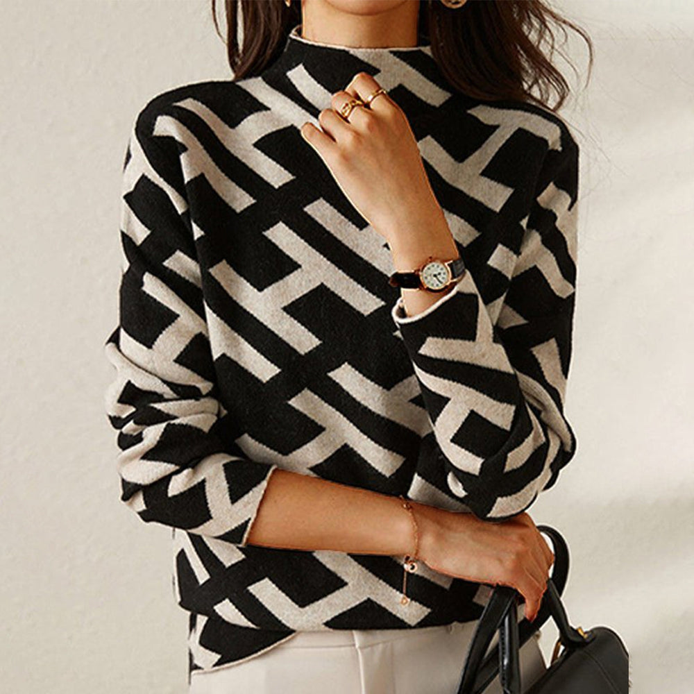 Pull roulé élégant Jessy de Danoir Paris, en tissu luxe, porté en pleine longueur avec col roulé et finition sophistiquée.