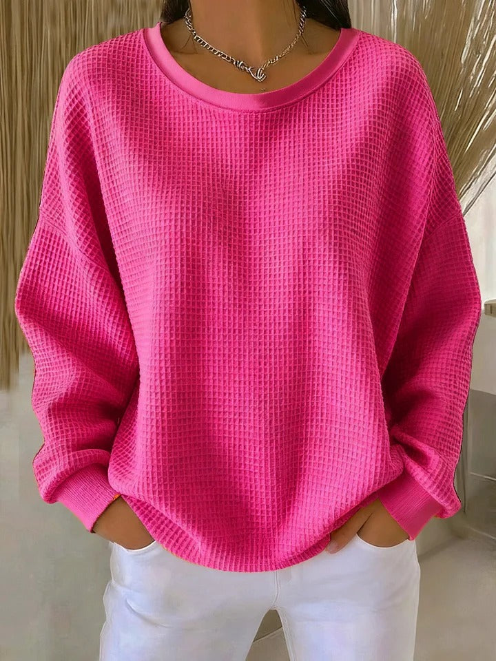 Pull Luna Danoir Paris en rose, élégant et confortable, avec un design moderne et tissu doux visible sur l'image.