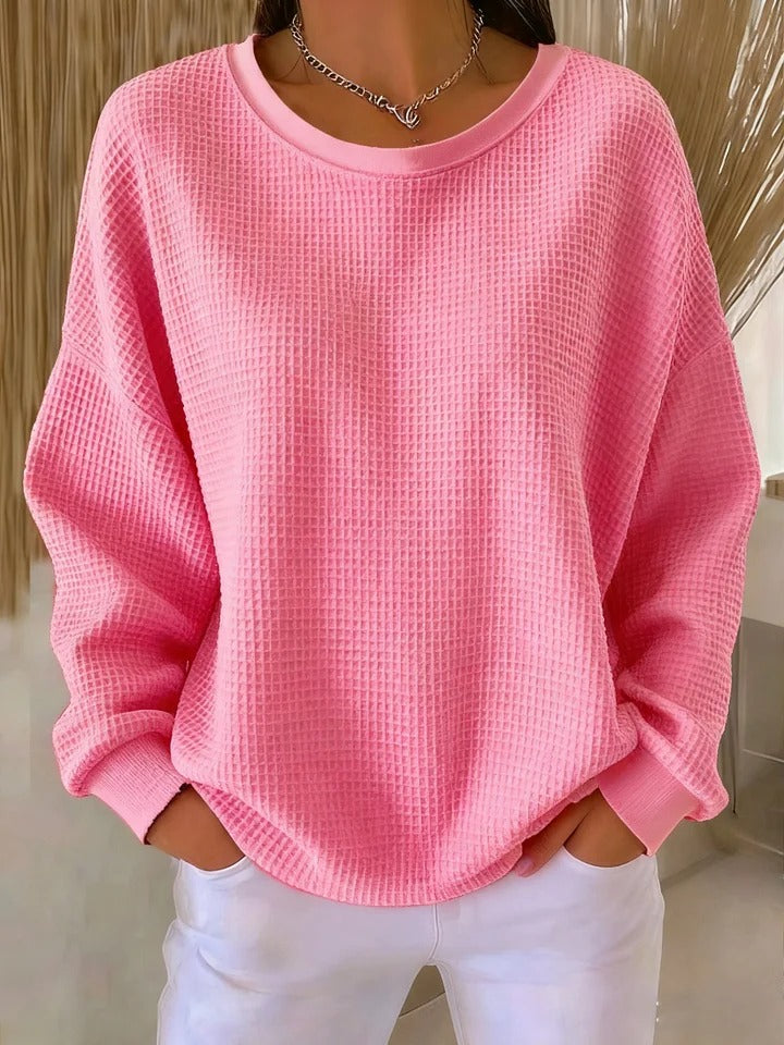 Pull Luna Danoir Paris, élégant et confortable, en rose, porté en mode décontracté, tissu doux et finition soignée.