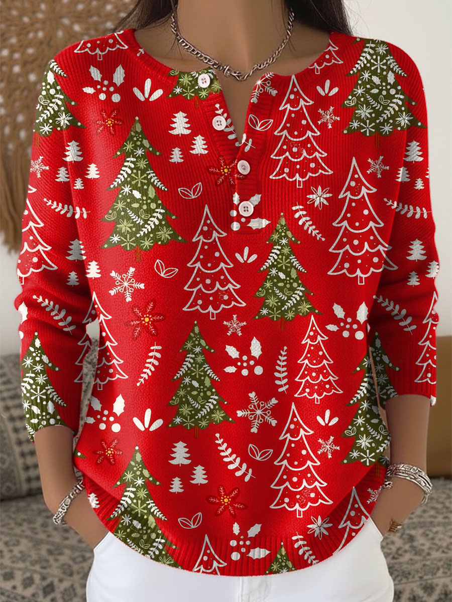 Pull de Noël festif Sofie de Danoir Paris, détail du motif de saison rouge et blanc, tissu doux et chaud.