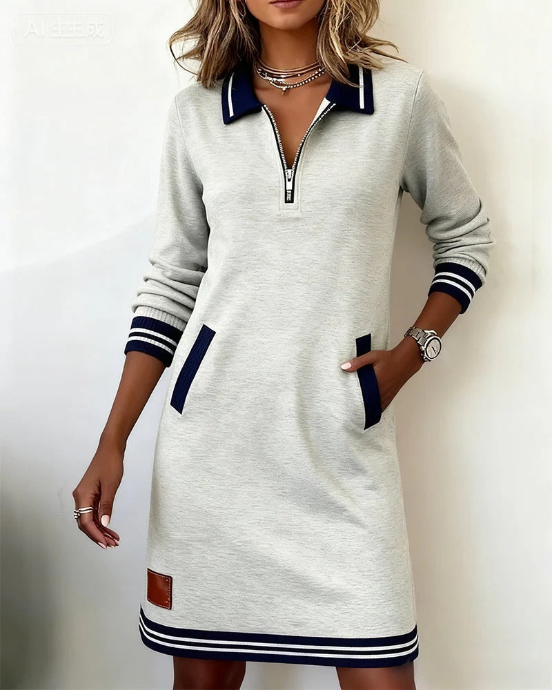 Robe Sporty-Chic élégante Nadege Danoir Paris, coupe moderne en tissu fluide, couleur neutre, portée décontractée et élégante.