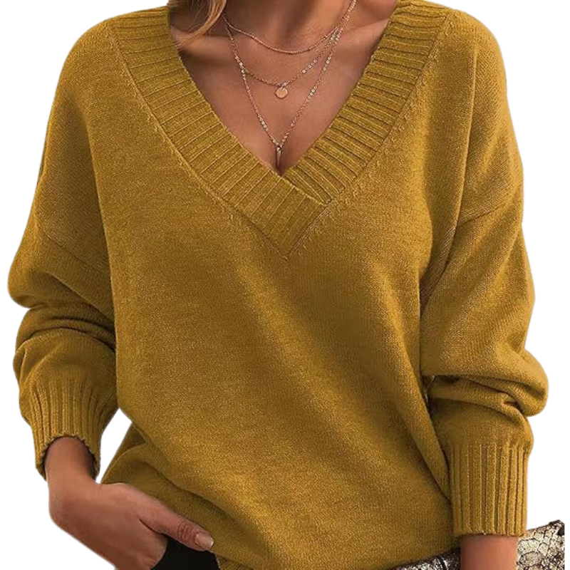 Pull en cachemire élégant de Danoir Paris, couleur abricot, avec un design chic et sophistiqué.