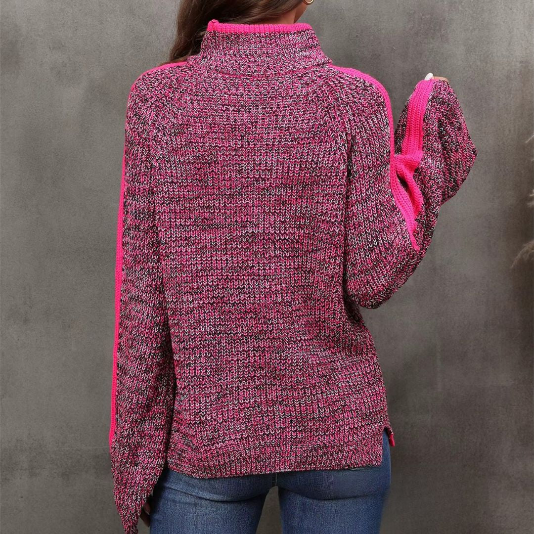 Pull patchwork chic Danoir Paris Diana, en tissu coloré avec motifs patchwork, porté avec col en V et manches longues.
