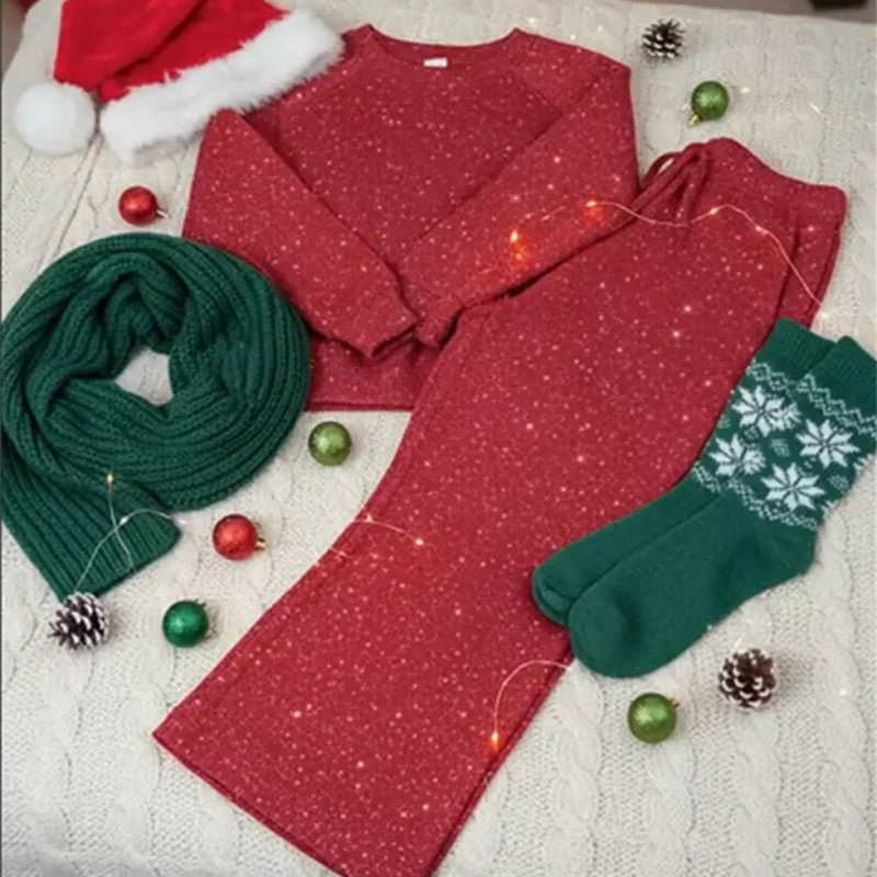 Ensemble hivernal pailleté Vera de Danoir Paris, avec veste à paillettes et pantalon assorti, porté sur un fond neutre.