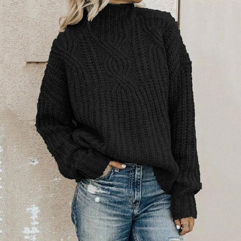 Pull en câble Danoir Paris Sofian, élégant et confortable, en tissu doux, porté par un modèle dans un cadre moderne.