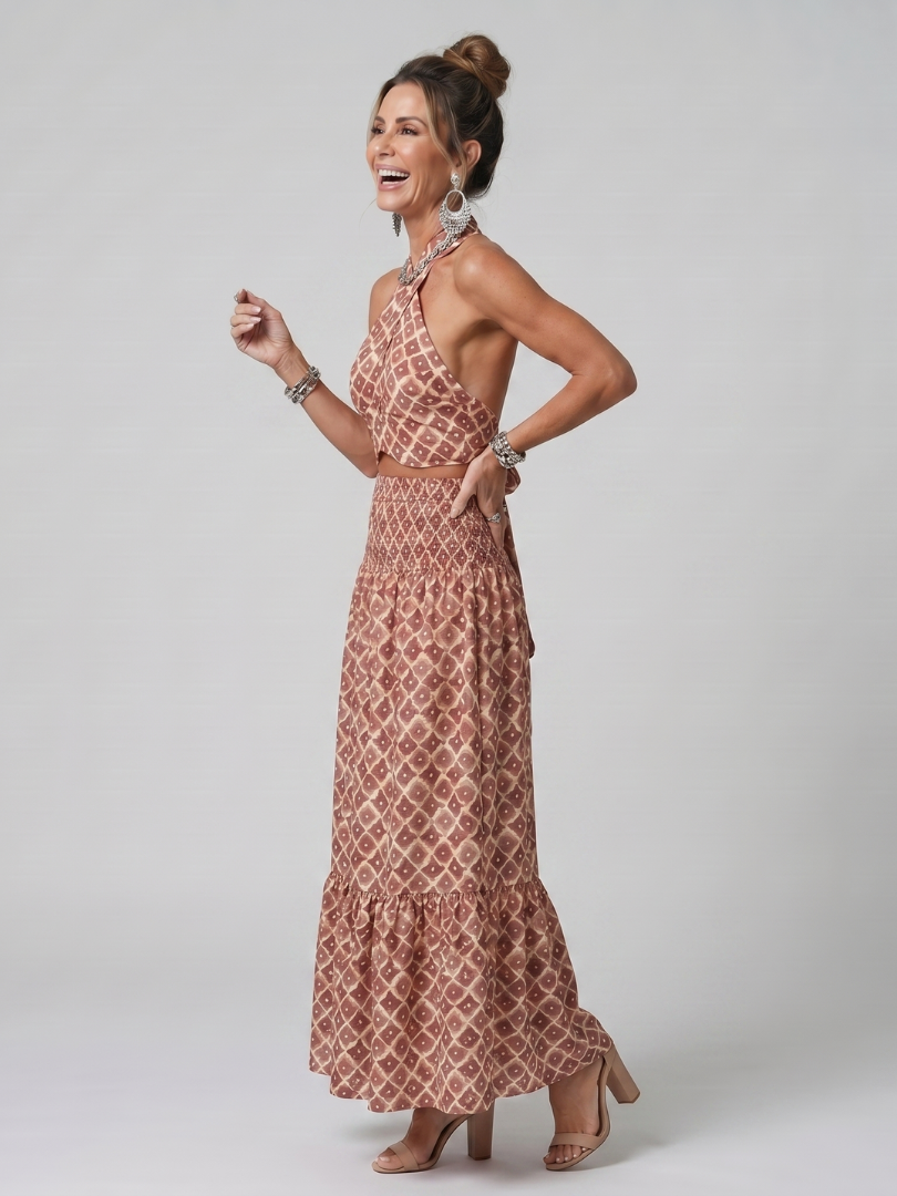 Robe midi Danoir Paris Amira à imprimé géométrique, coupe croisée et détails découpés, style élégant et moderne.