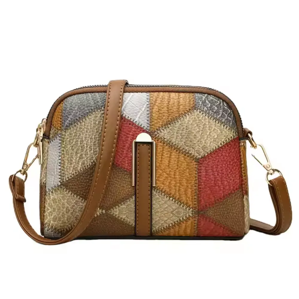 Mini sac bandoulière Danoir Paris Clio en patchwork gris, avec poignet et détails en cuir synthétique.