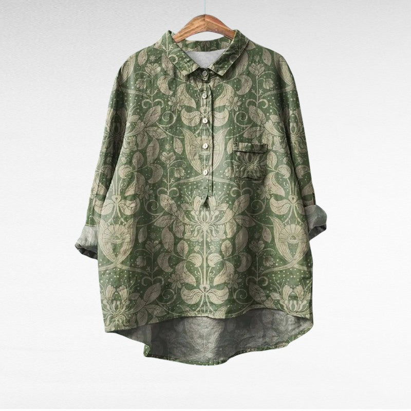 Blouse fleurie rétro Marjolaine de Danoir Paris, tissu léger avec motif floral coloré, manches longues et col élégant.