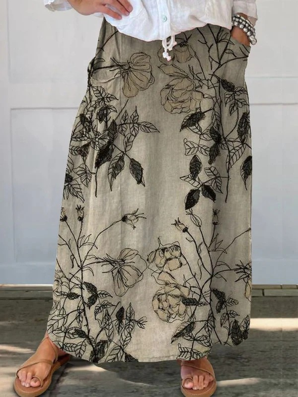 Jupe portefeuille Danoir Paris Kisses en kaki avec motif floral rétro, taille élastique et poches, style vintage élégant.