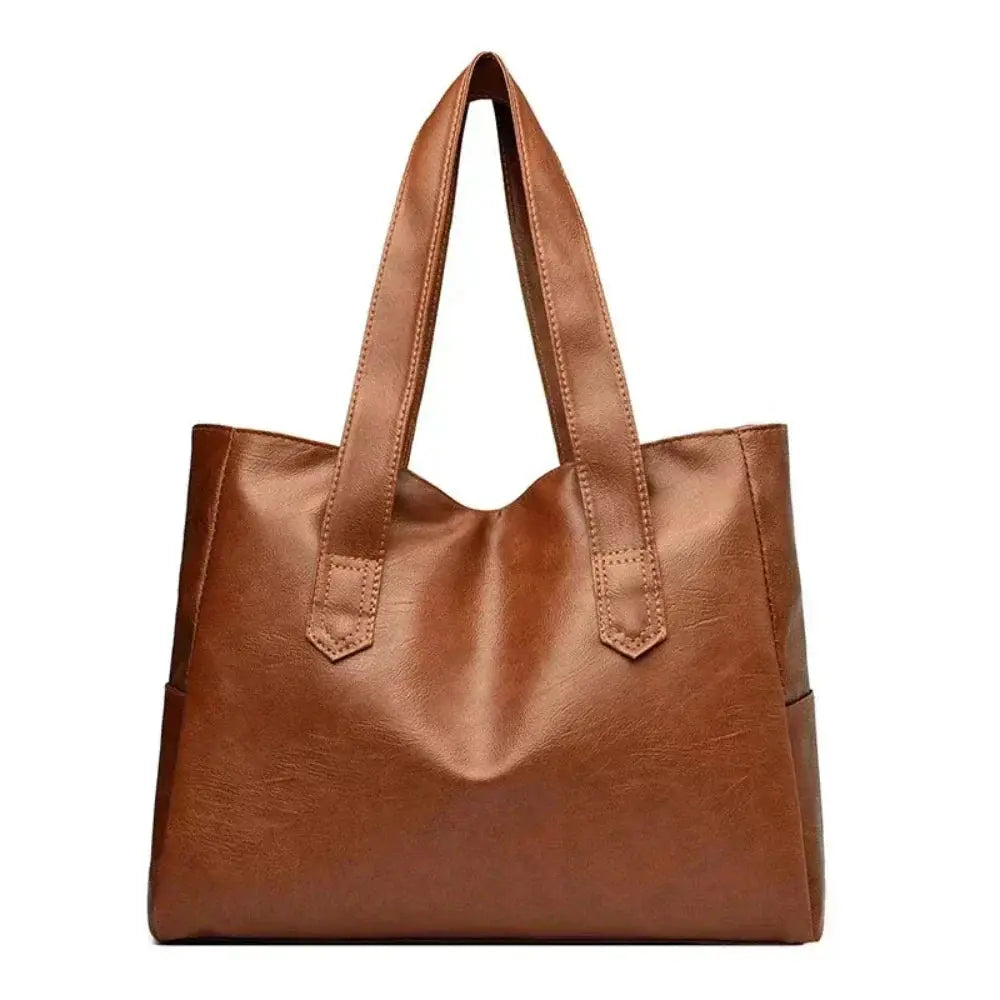 Sac à main minimaliste et élégant de Danoir Paris, en marron, avec design épuré et finition sophistiquée.