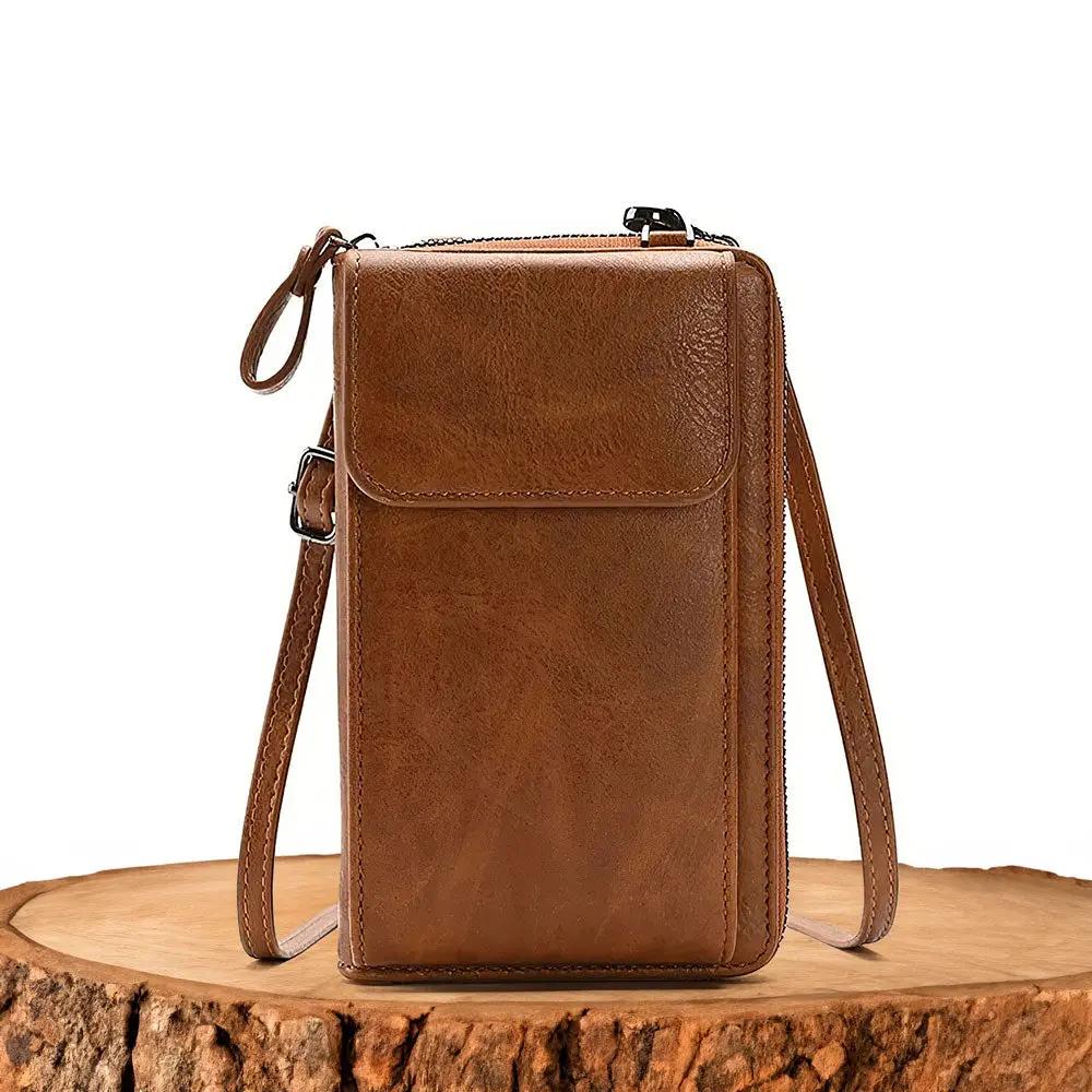 Sac Lydia de Danoir Paris en marron, élégant et élancé, avec poignées en cuir et design sophistiqué.