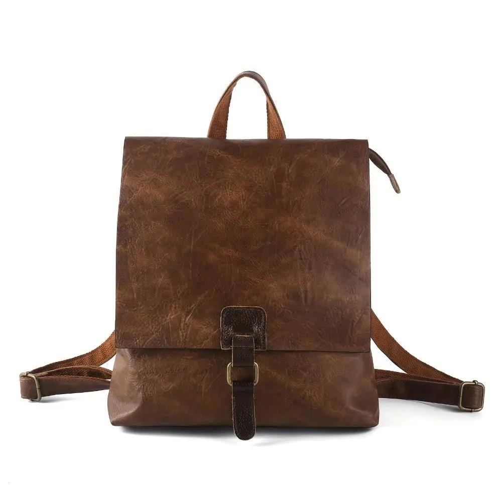 Sac à dos Danoir Paris Nina en cuir marron, style vintage, avec poches et bretelles réglables.