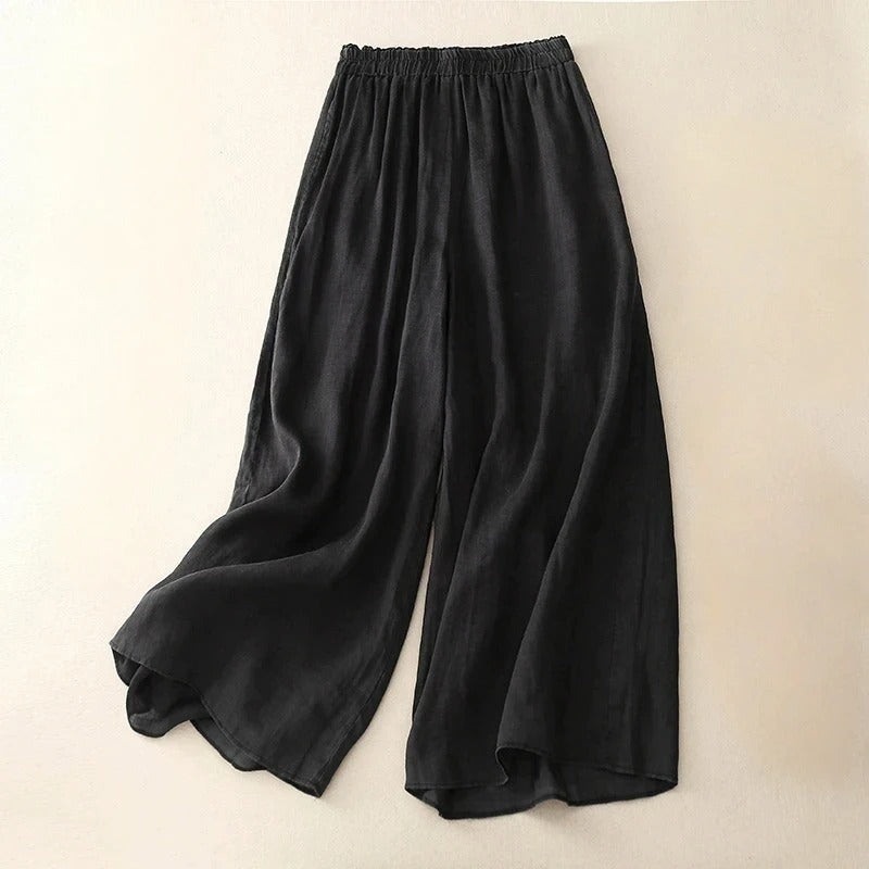 Pantalons en lin élégants Nicolé par Danoir Paris, tissu léger et fluide, coupe sophistiquée, couleur neutre, détails modernes.