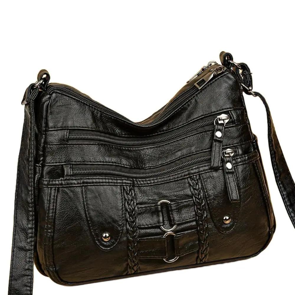 Sac bandoulière sécurisé Danoir Paris Ivy noir avec fermeture robuste et poignées élégantes, idéal pour un style pratique et sécurisé.