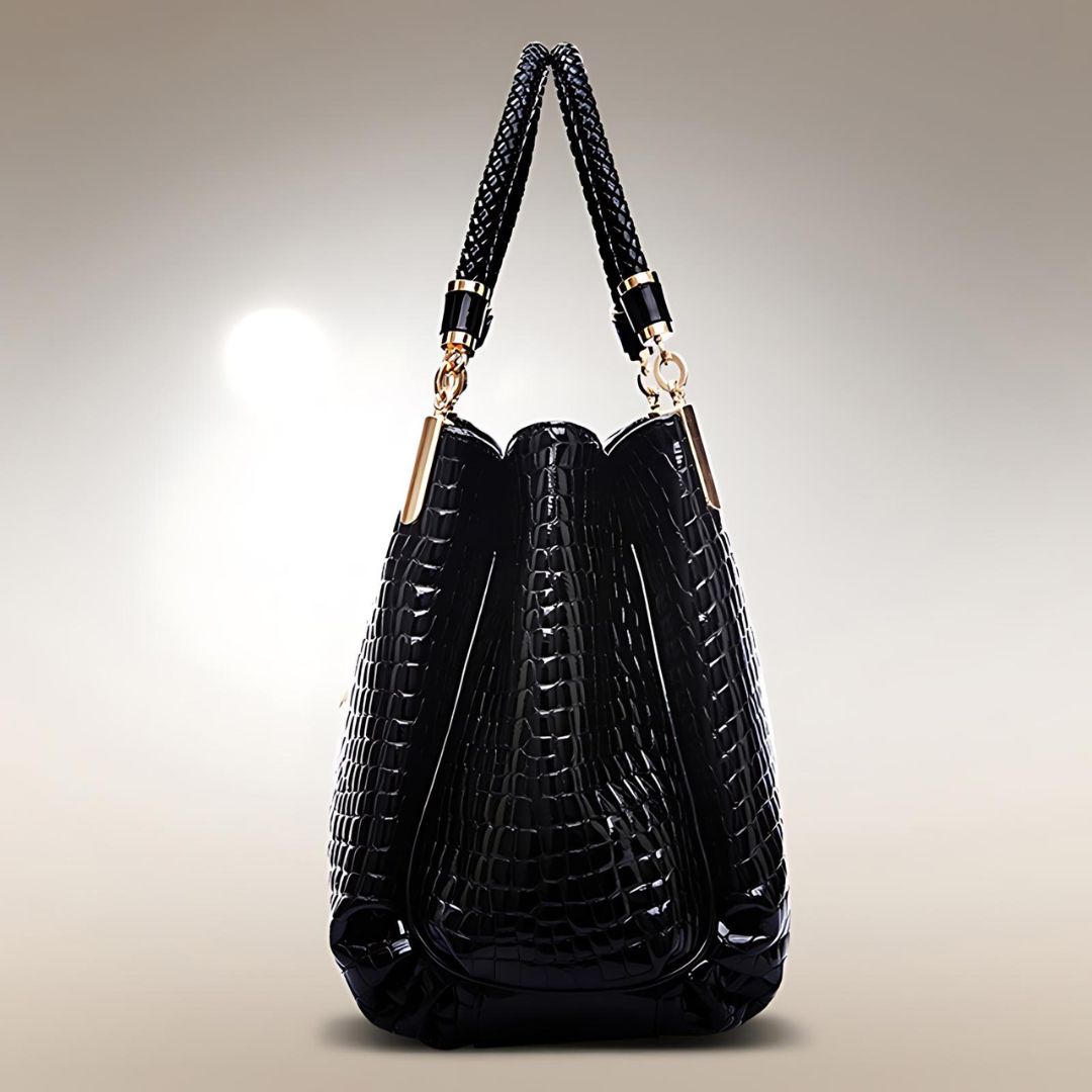 Sac à main en crocodile noir Lusso Milano de Danoir Paris, avec poignée élégante et finition sophistiquée.