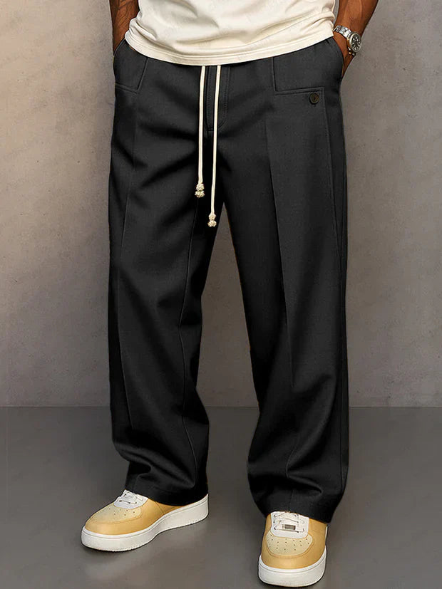 Pantalon élégant noir Danoir Paris Duval Paris avec cordon ajustable, tissu fluide et coupe moderne pour homme.
