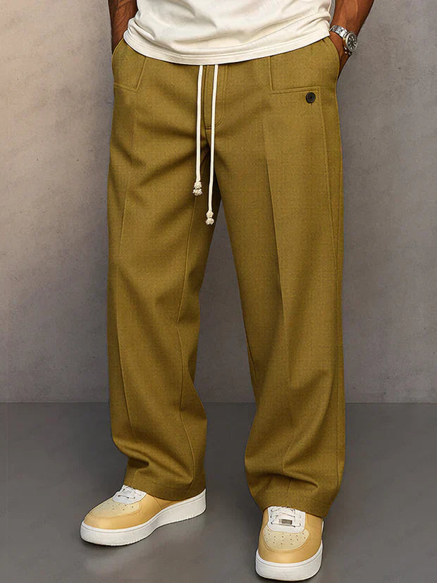 Pantalon élégant noir Danoir Paris Didier avec cordon ajustable, tissu fluide, coupe tendance, porté par un mannequin.