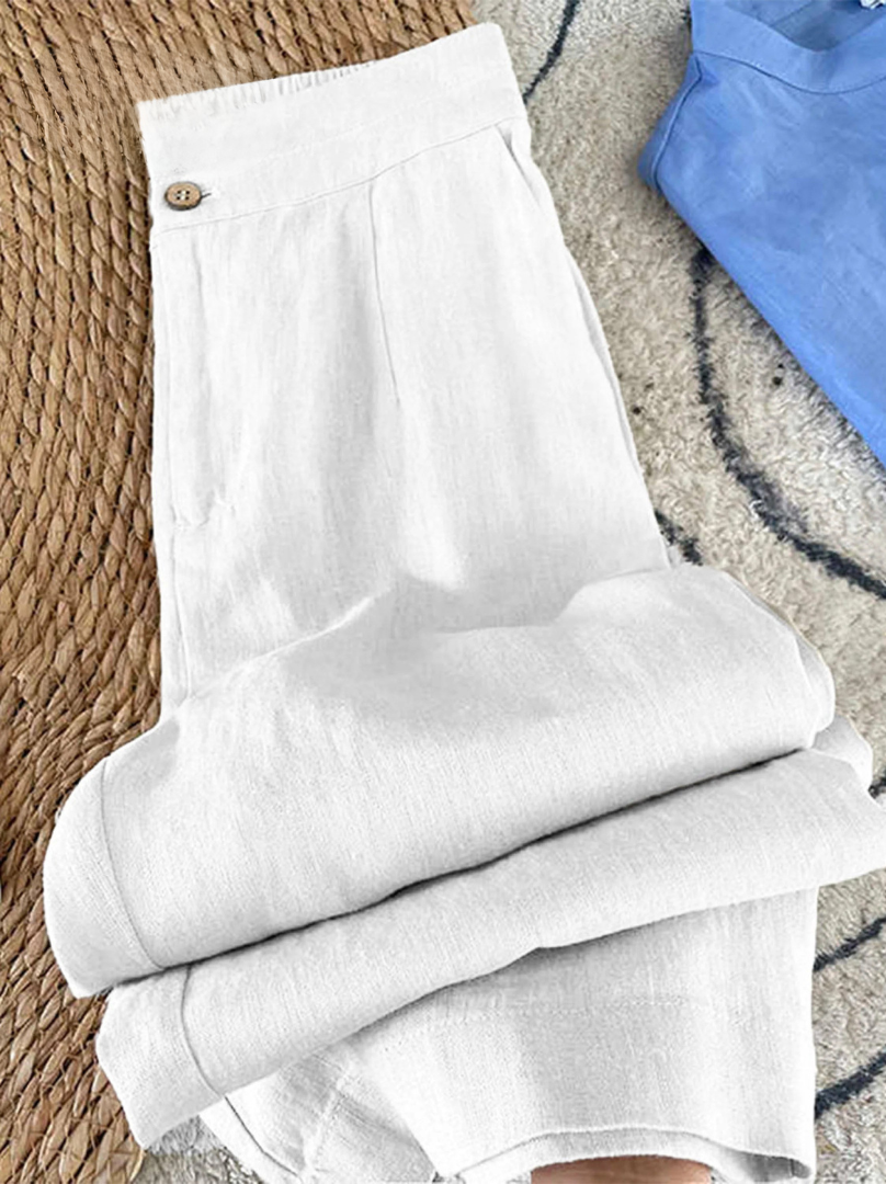 Pantalon Maia en lin gris de Danoir Paris, style moderne et minimaliste, porté avec guide des tailles sur fond blanc.