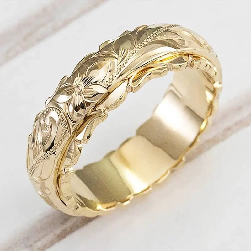 Bague en or Danoir Paris avec motif floral ancien, bijoux élégant et finement travaillé, vue de face.