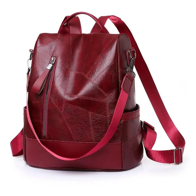 Sac à main rouge Freya de Danoir Paris pour un usage quotidien, avec poignées et compartiments visibles.